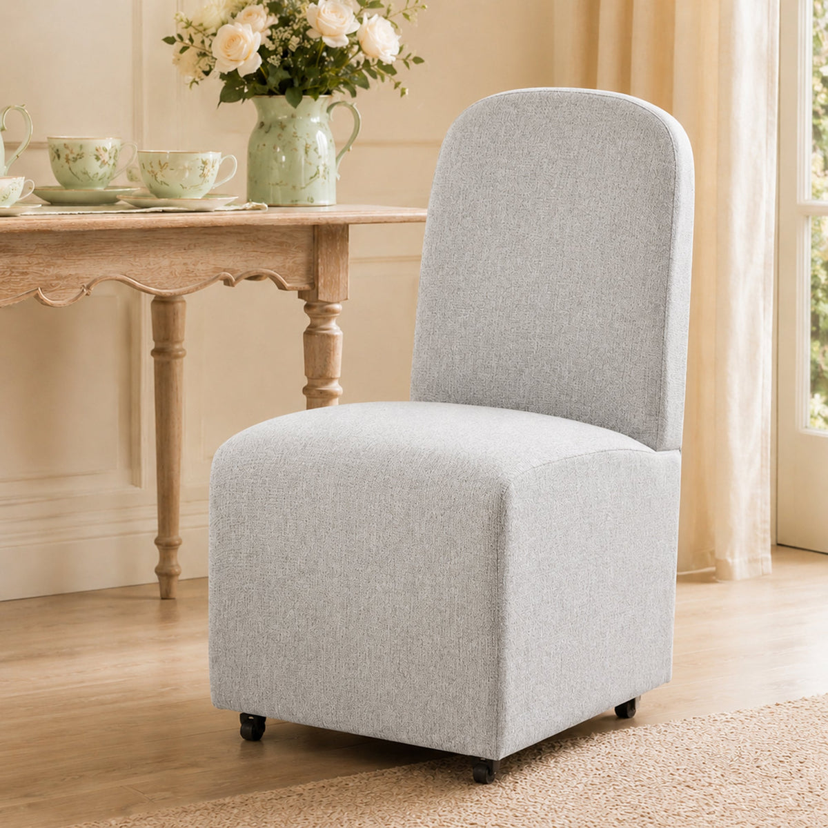 French Farmhouse Upholstered Dining Chair with Rounded Back, Caster Legs & Skirted Design